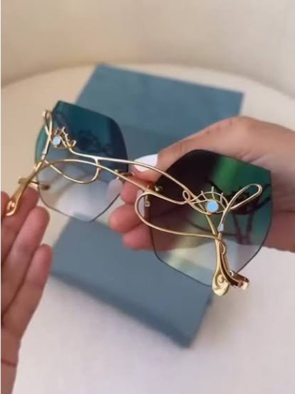 For Art’s Sake 18k gold plated sunglasses with eye design
